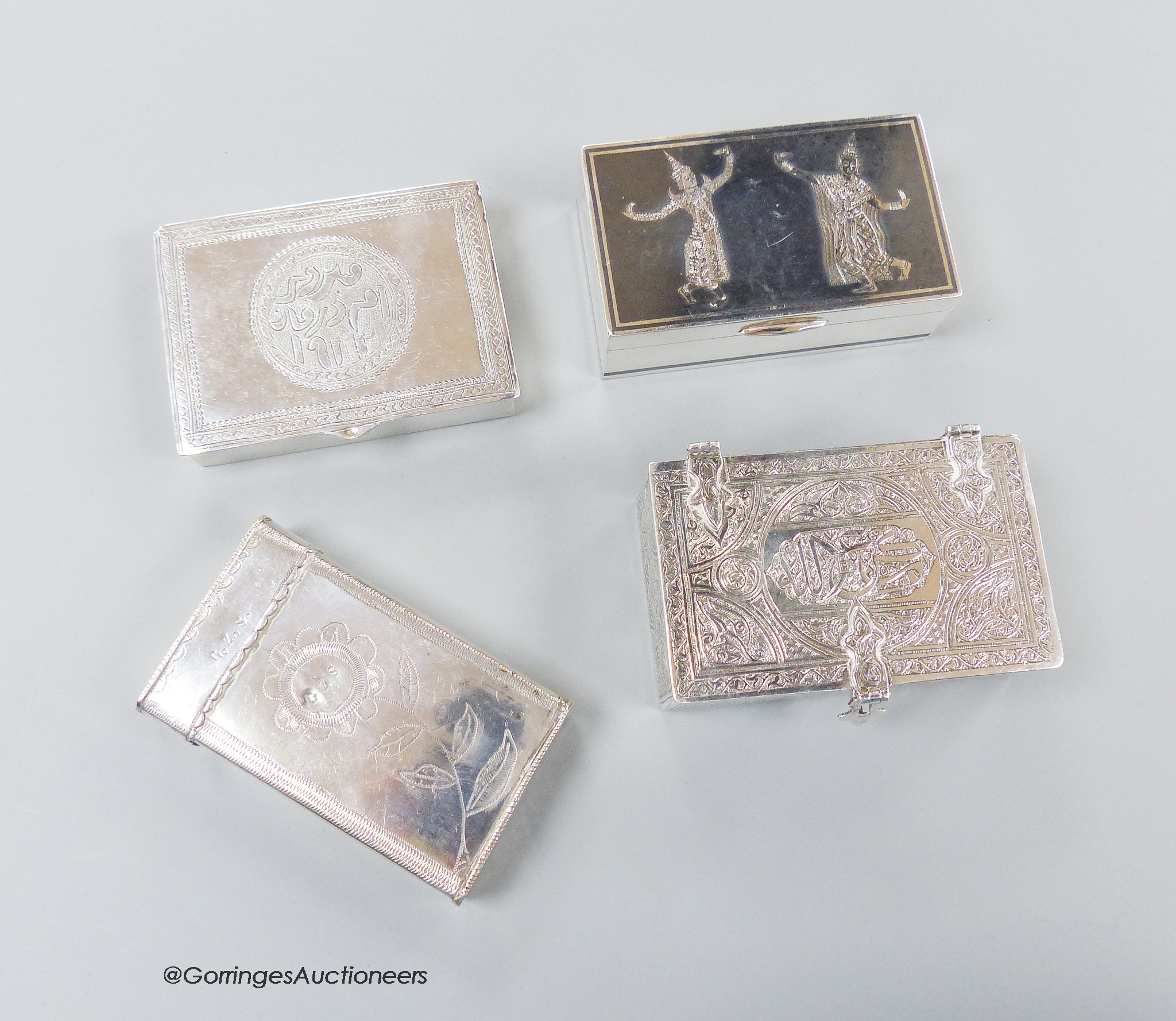 A 20th century Egyptian engraved white metal rectangular box, 85mm and three other continental white metal boxes including niello, gross weight 13.5oz.